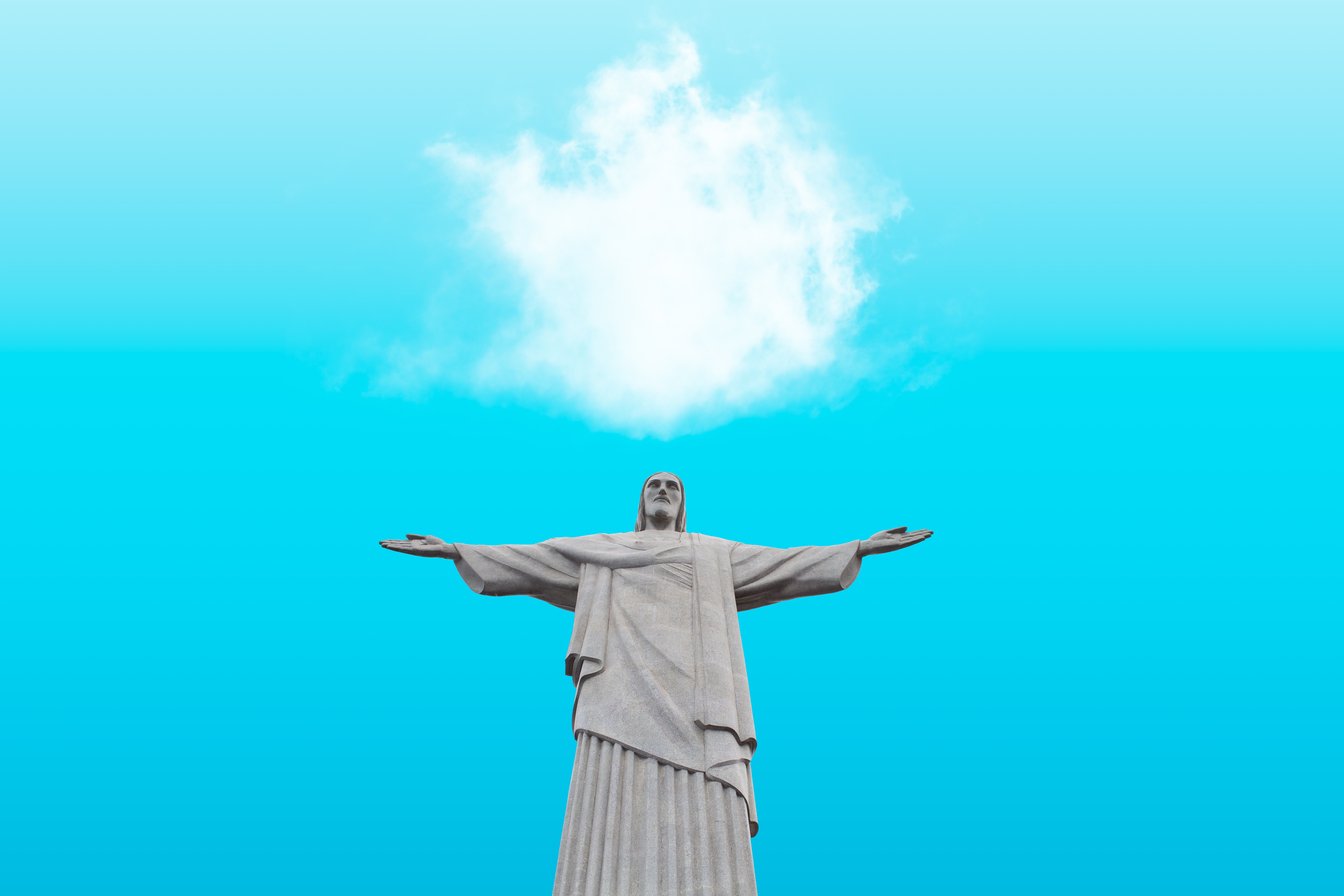 Cristo Redentor de bra&ccedil;os abertos sob o c&eacute;u azul